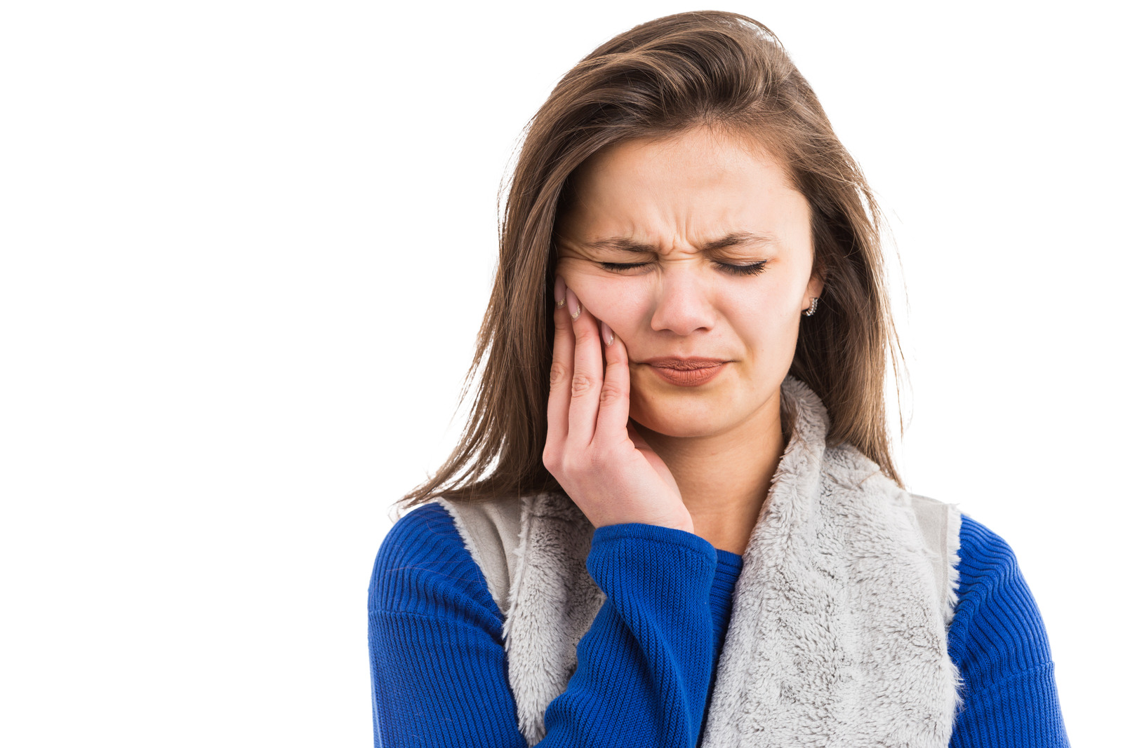 Young woman suffering acute tooth ache pressing on cheek area as painful caries dental problem isolated on white background